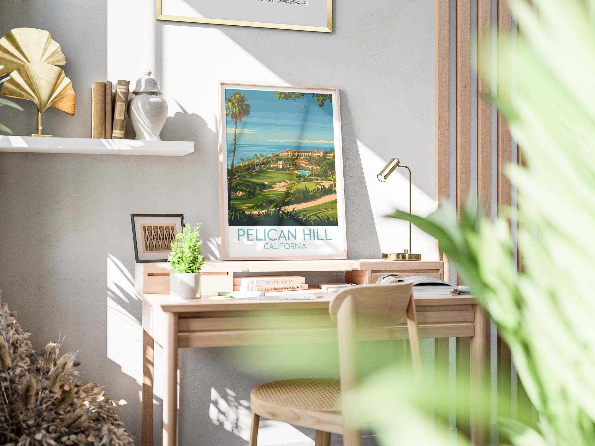 Pelican Hill travel poster on desk California